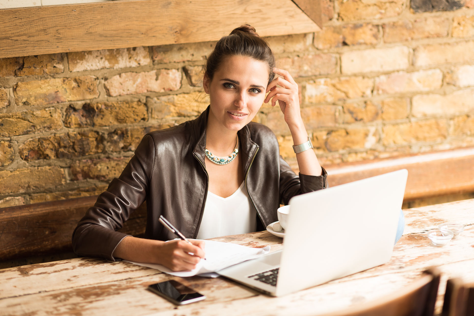 beautiful-woman-sitting-working-laptop-cafe-notes-islington-london-business-photographer-10